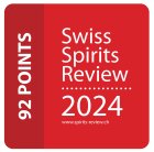Insigne rouge avec texte blanc indiquant : 92 Points à gauche et Swiss Spirits Review 2024 www.spirits-review.ch à droite, indiquant une récompense ou une note pour un spiritueux.